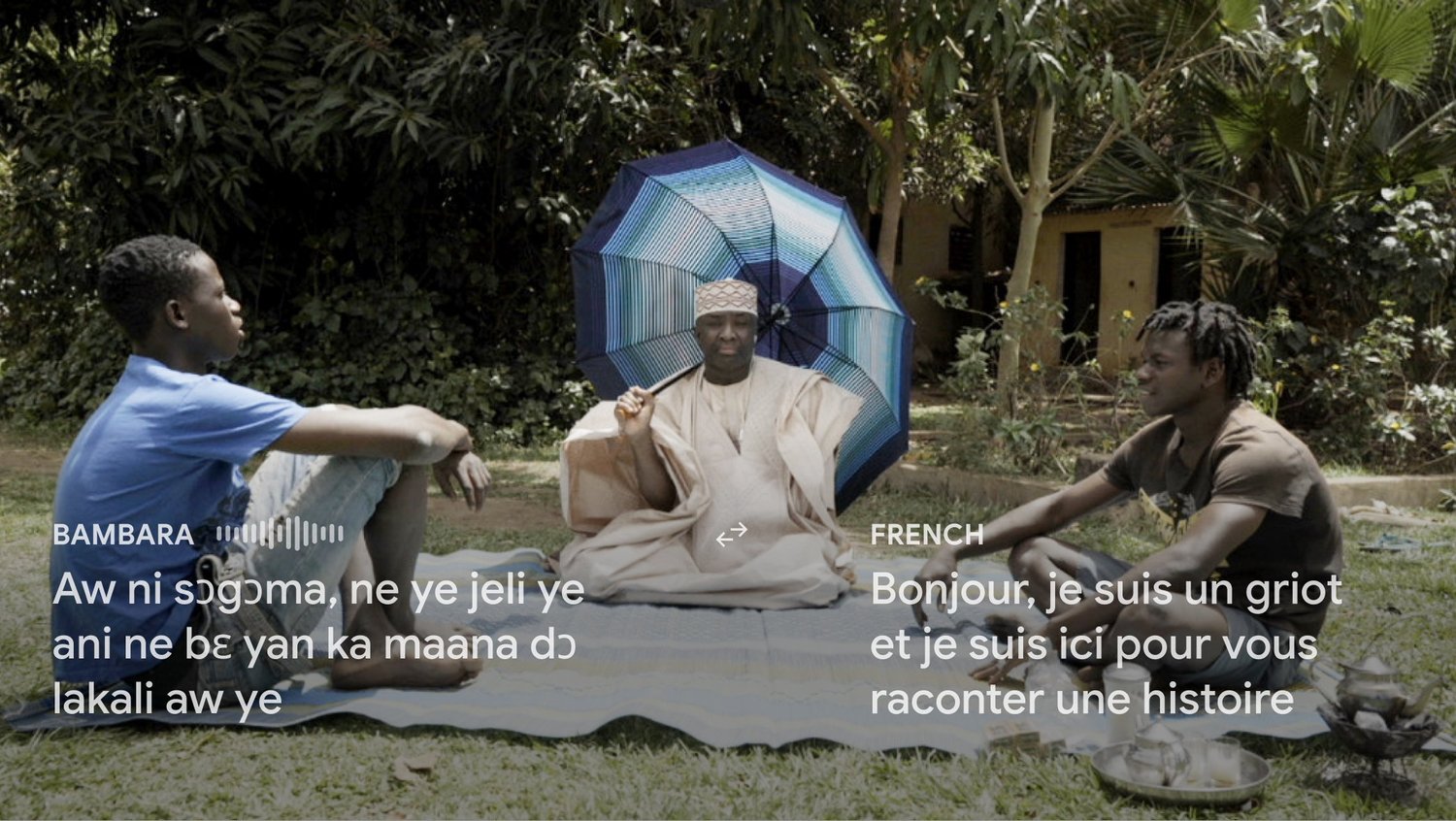 A griot tells a story to two young men; subtitles in Bambara and French.